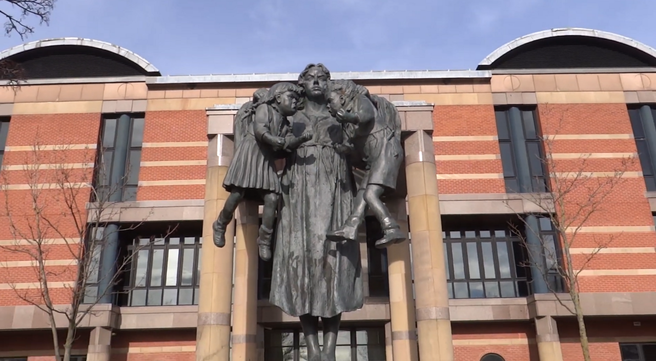 Bronze scales of justice statue