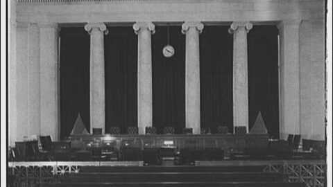 Interior of the United States Supreme Court courtroom viewed from the rear